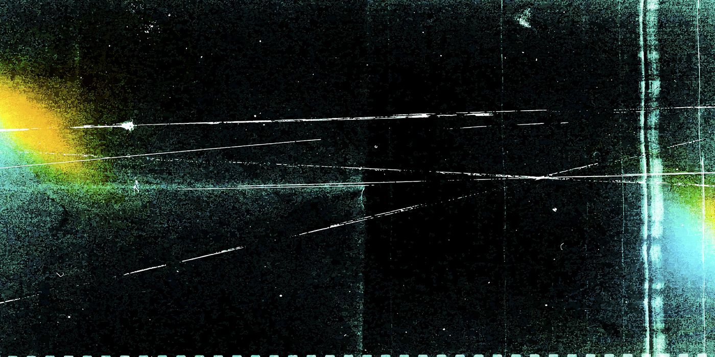 Scratched dark film grain with light leaks